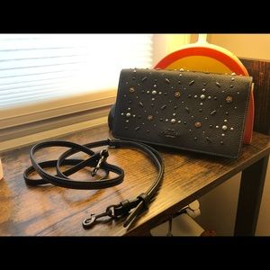 “Like new” Coach Hayden clutch in midnight blue